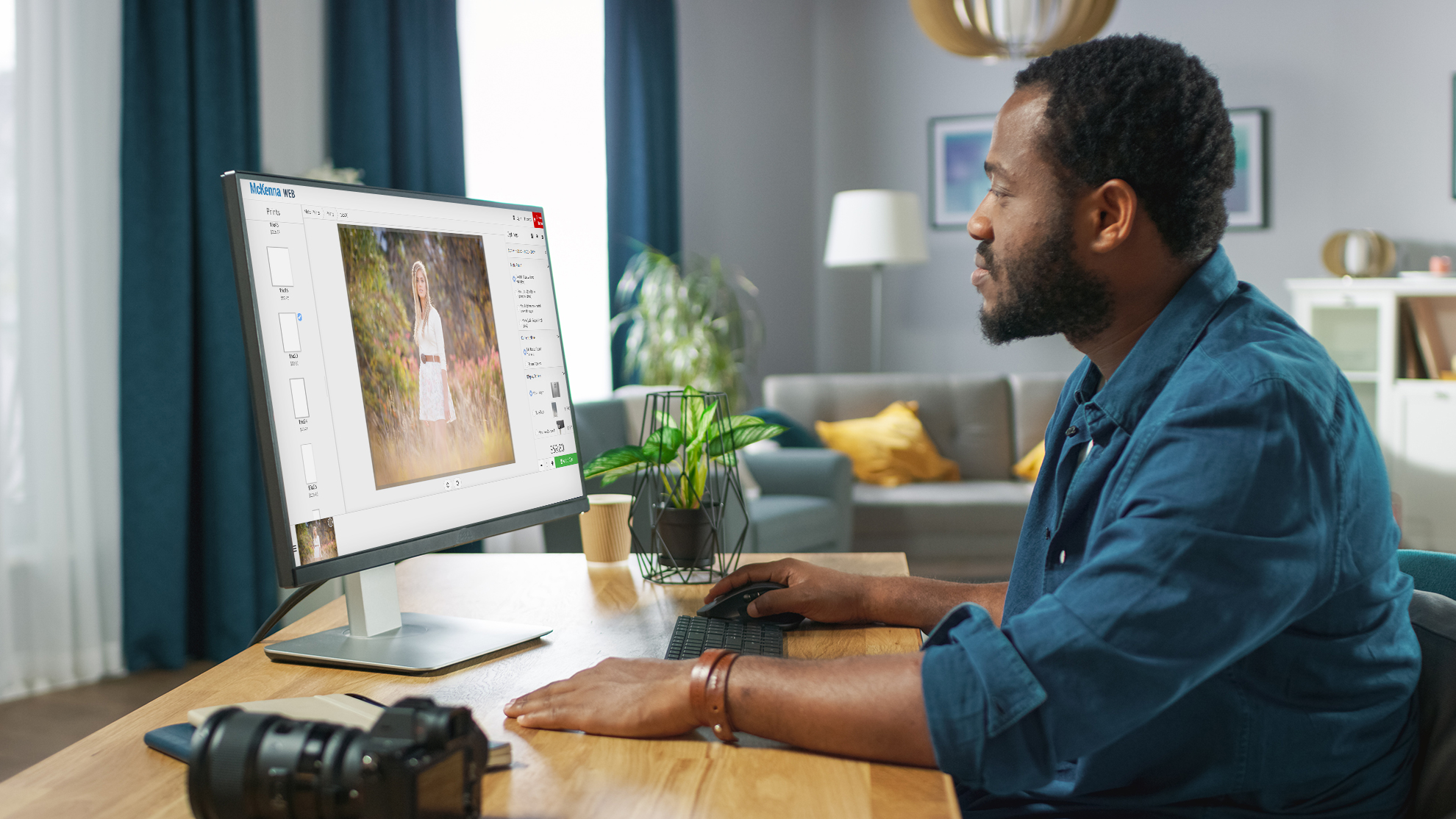 Photographer sitting at computer using McKenna Web